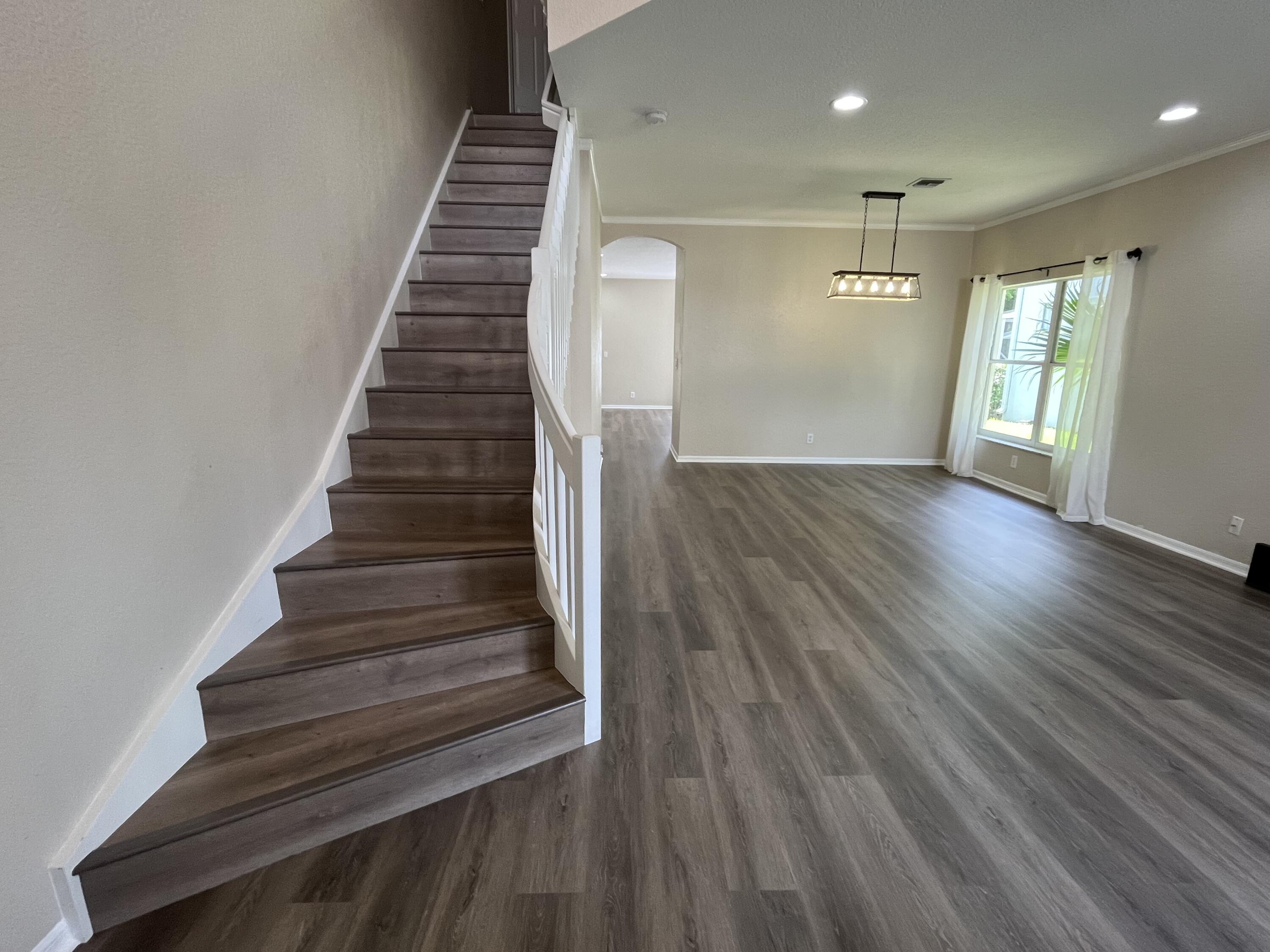 7299 Panache Way Boca Raton, FL 33433 - Photo 7 of 16 a view of entryway and hall with wooden floor
