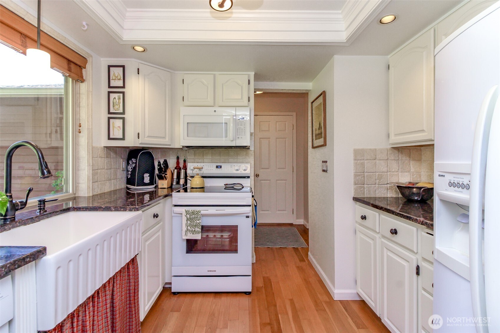 33305 41st Avenue Southwest Federal Way, WA 98023 - Photo 11 of 40 a kitchen with stainless steel appliances sink a stove and cabinets