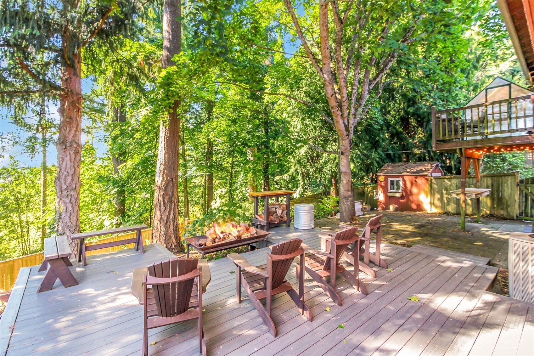 33305 41st Avenue Southwest Federal Way, WA 98023 - Photo 32 of 40 a view of a patio with table and chairs and potted plants with wooden floor and fence