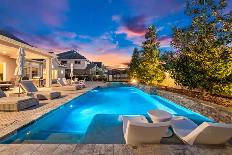 a view of a backyard with sitting area