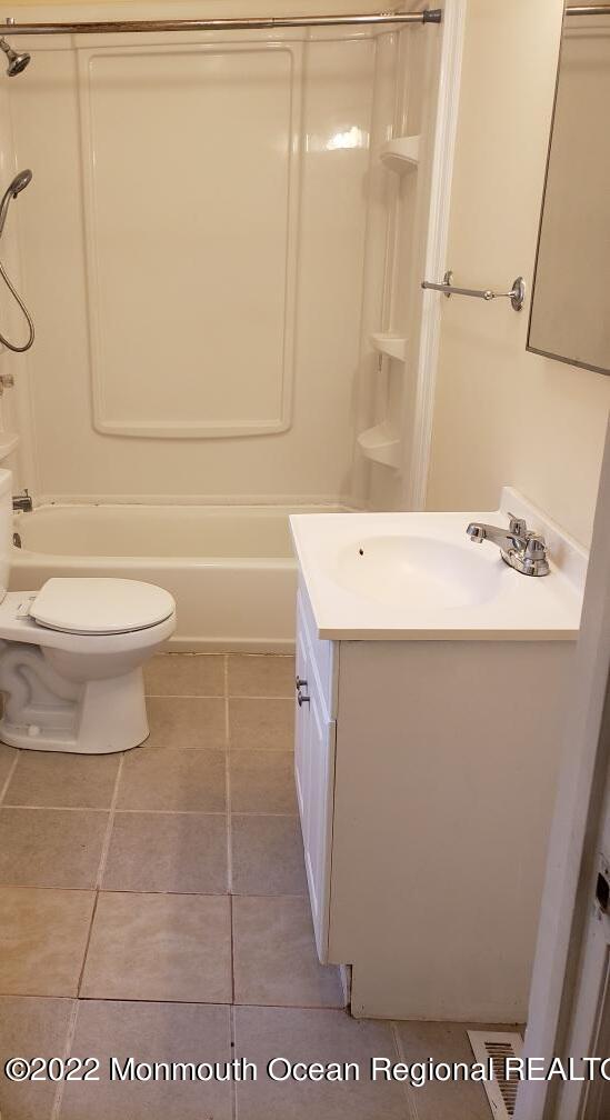 683 Mantoloking Road Brick, NJ 08723 - Photo 6 of 8 a bathroom with a sink a toilet and shower