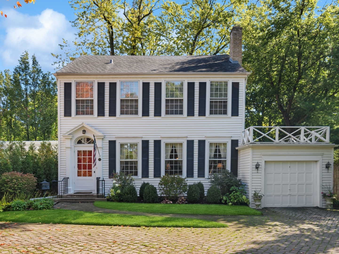 451 North Green Bay Road Lake Forest, IL 60045 - Photo 1 of 24 a view of a brick house next to a yard with large trees