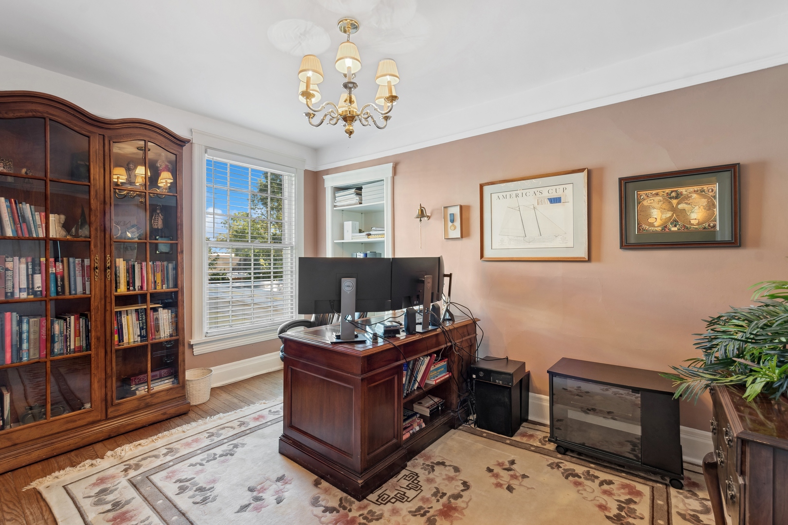 451 North Green Bay Road Lake Forest, IL 60045 - Photo 12 of 24 a view of a workspace with a bookshelf