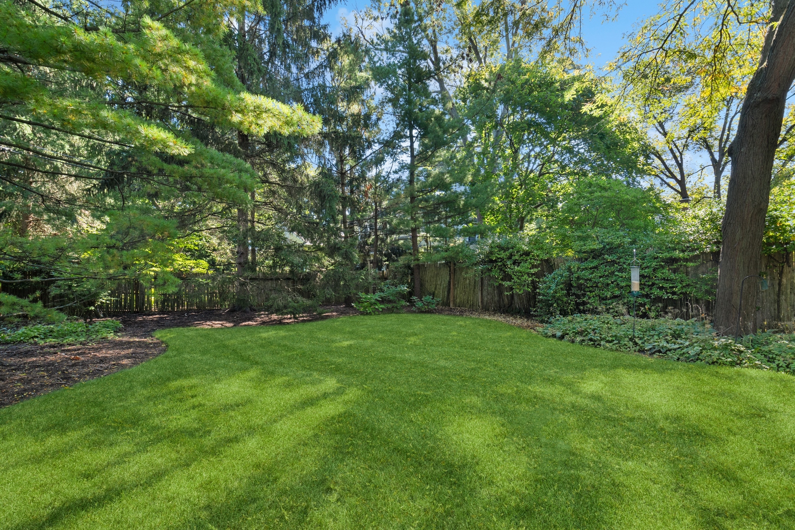 451 North Green Bay Road Lake Forest, IL 60045 - Photo 19 of 24 a view of a grassy field with trees