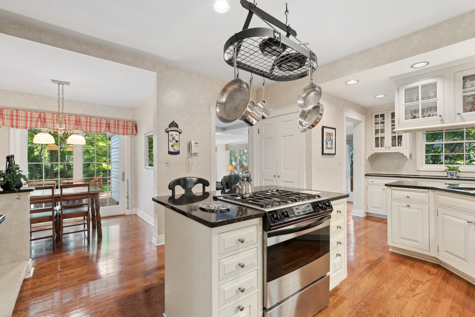 451 North Green Bay Road Lake Forest, IL 60045 - Photo 8 of 24 a kitchen with stainless steel appliances a stove a table and chairs in it