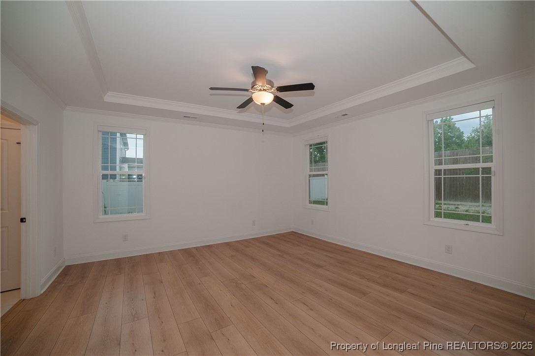 212 Stafford Avenue Raeford, NC 28376 - Photo 20 of 41 a view of empty room with wooden floor and fan