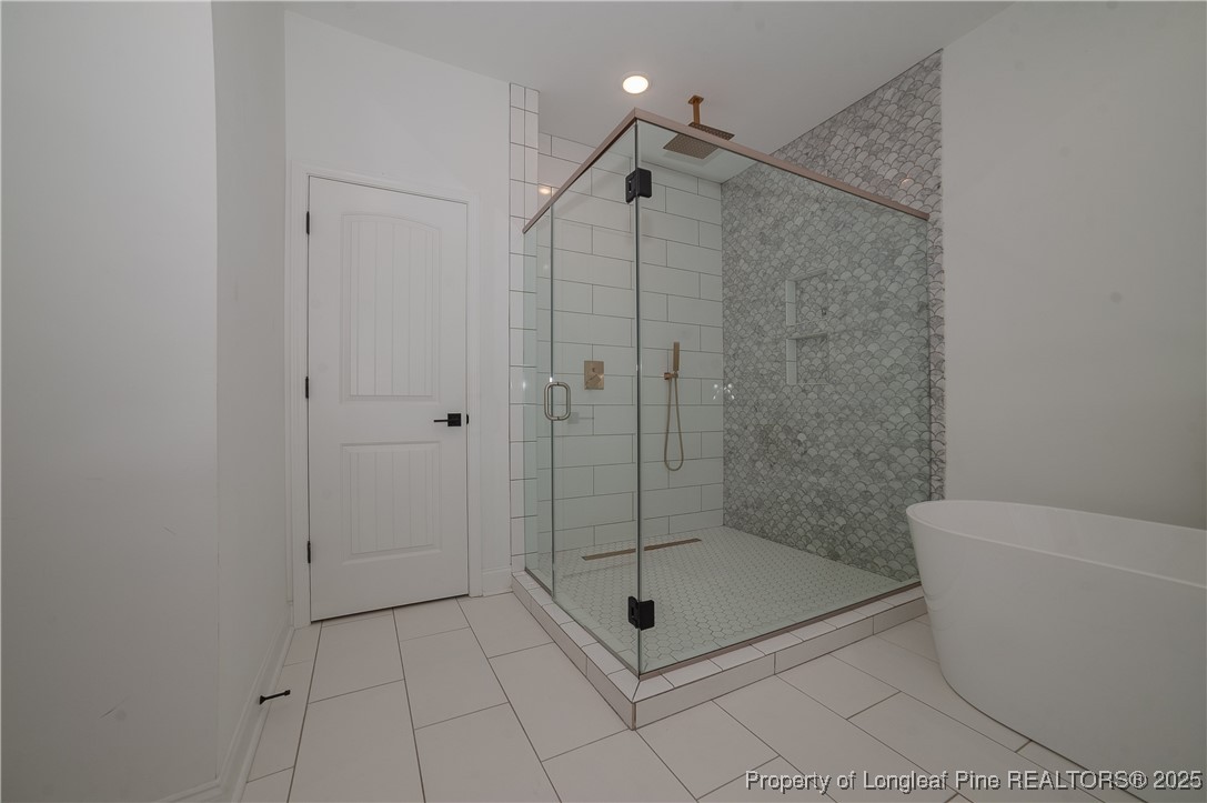 212 Stafford Avenue Raeford, NC 28376 - Photo 25 of 41 a bathroom with a shower a toilet and a sink