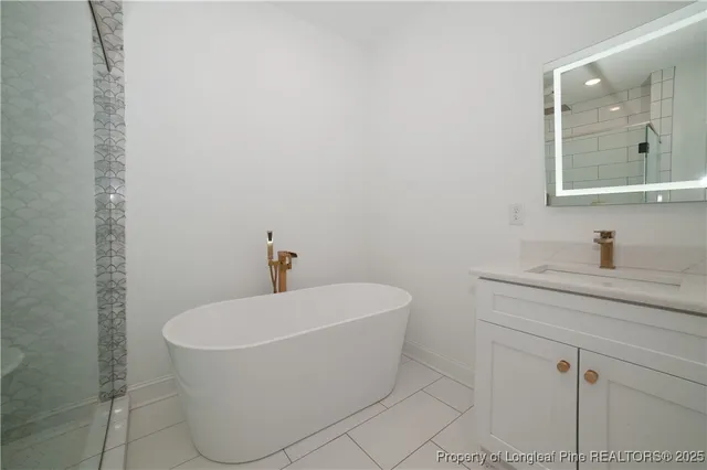a white bath tub sitting in a bathroom