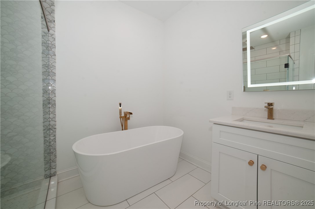 212 Stafford Avenue Raeford, NC 28376 - Photo 26 of 41 a white bath tub sitting in a bathroom