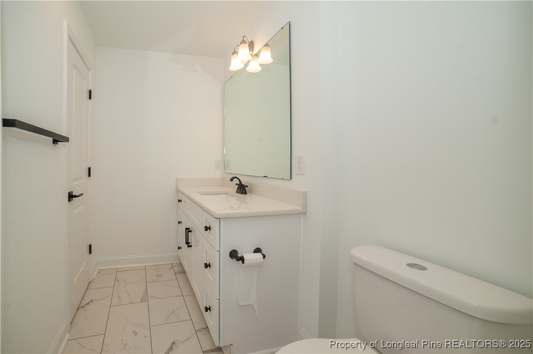 212 Stafford Avenue Raeford, NC 28376 - Photo 36 of 41 a bathroom with a sink a toilet and shower