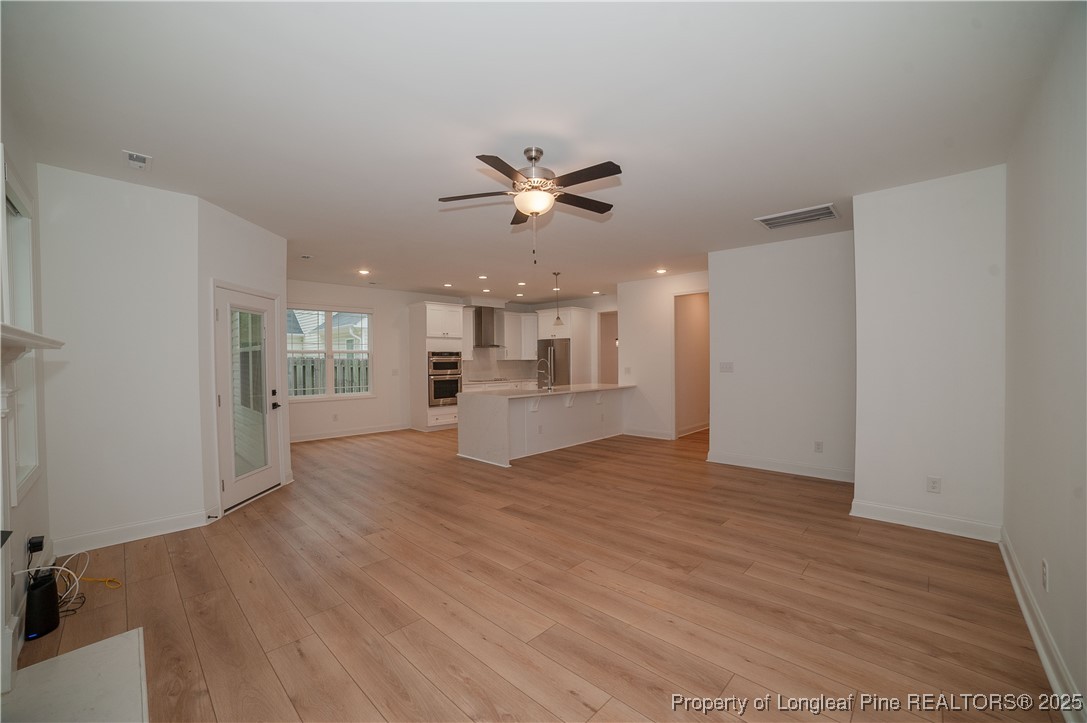 212 Stafford Avenue Raeford, NC 28376 - Photo 9 of 41 a view of an empty room with a kitchen
