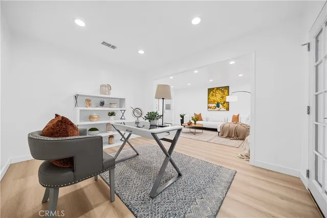 a living room with furniture and a rug