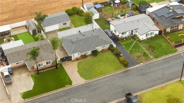 an aerial view of a pool yard swimming pool and outdoor seating