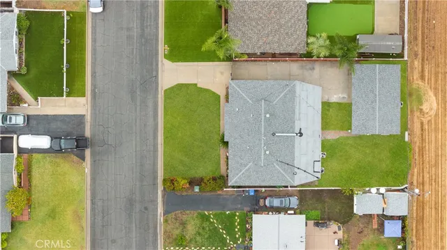 an aerial view of a house with a swimming pool