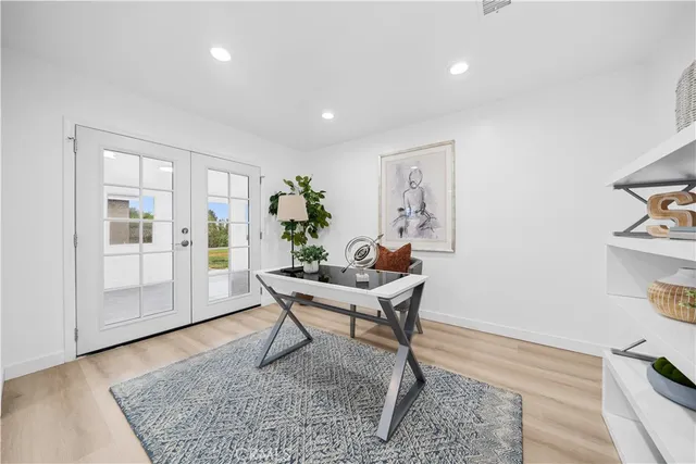 a work room with furniture and wooden floor