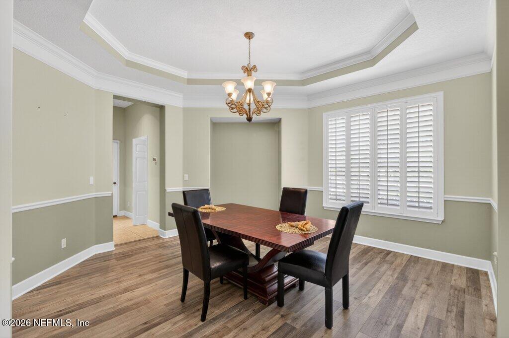 1664 Fairway Ridge Drive Fleming Island, FL 32003 - Photo 12 of 103 a view of a dining room with furniture window and wooden floor