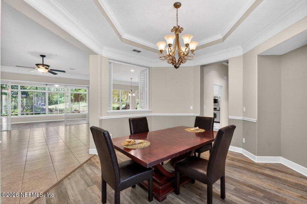 1664 Fairway Ridge Drive Fleming Island, FL 32003 - Photo 14 of 103 a view of a dining room with furniture window and wooden floor