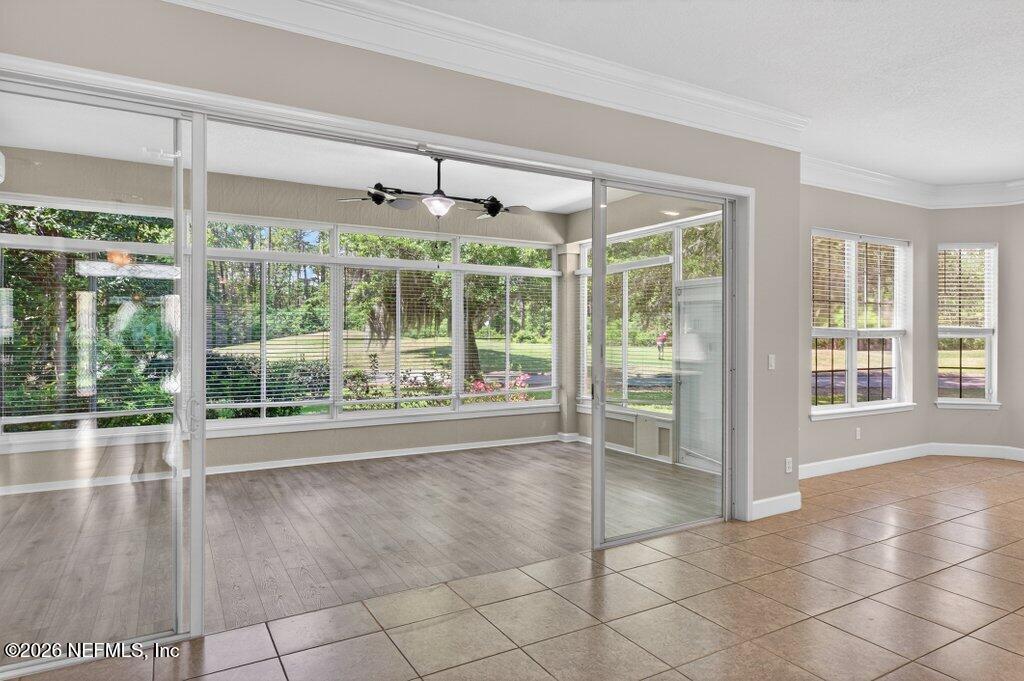 1664 Fairway Ridge Drive Fleming Island, FL 32003 - Photo 33 of 103 a view of an empty room with a floor to ceiling window and wooden floor