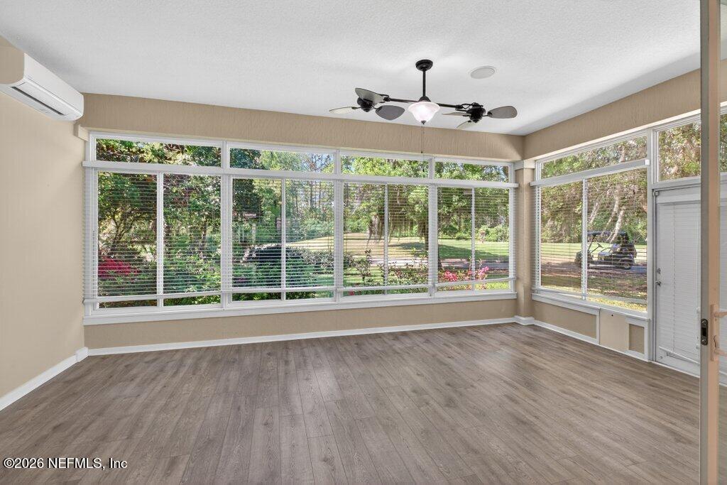 1664 Fairway Ridge Drive Fleming Island, FL 32003 - Photo 35 of 103 a view of an empty room with wooden floor and a window