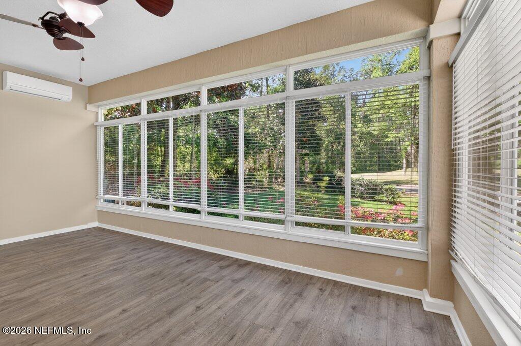 1664 Fairway Ridge Drive Fleming Island, FL 32003 - Photo 36 of 103 a view of an empty room with wooden floor and a window