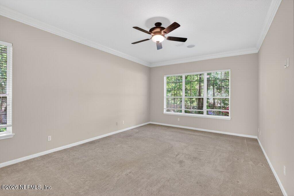 1664 Fairway Ridge Drive Fleming Island, FL 32003 - Photo 42 of 103 a view of a livingroom with a ceiling fan and window