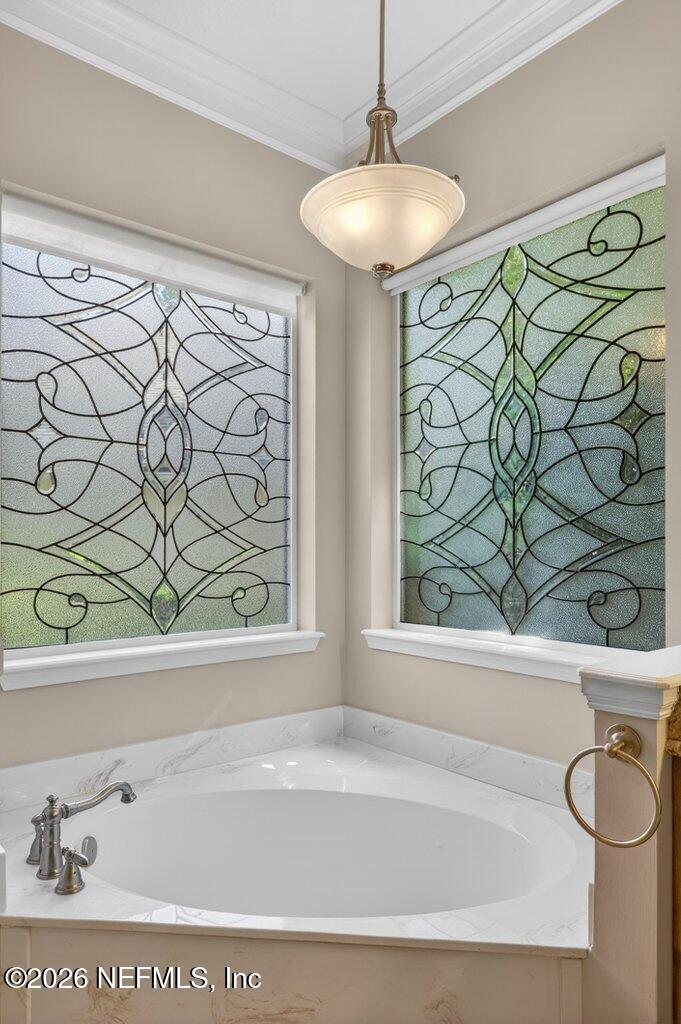 1664 Fairway Ridge Drive Fleming Island, FL 32003 - Photo 48 of 103 a bathroom with a bathtub and a shower