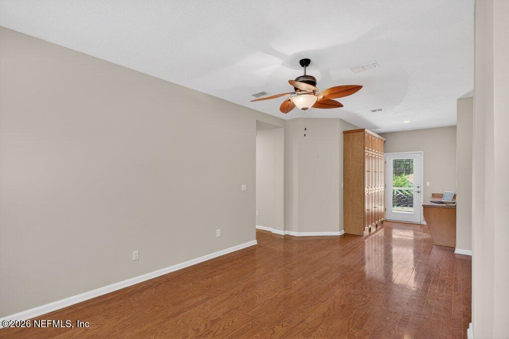 1664 Fairway Ridge Drive Fleming Island, FL 32003 - Photo 54 of 103 a view of an empty room with wooden floor