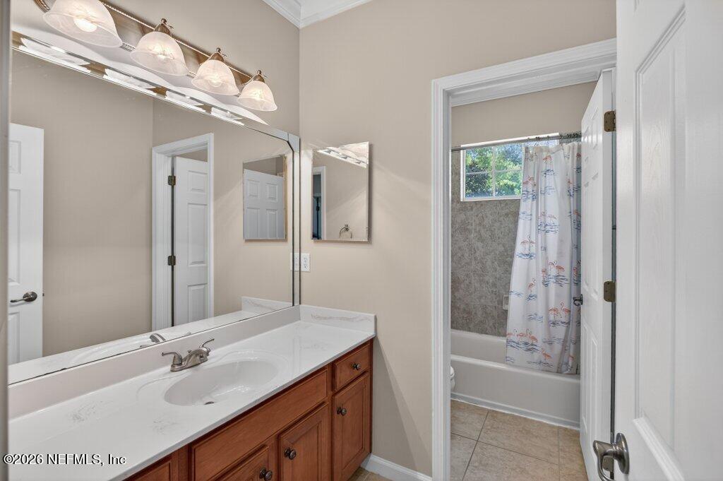 1664 Fairway Ridge Drive Fleming Island, FL 32003 - Photo 59 of 103 a bathroom with a bathtub a sink and a mirror