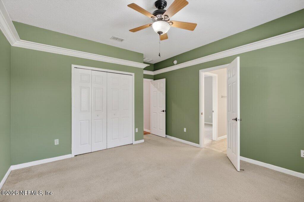 1664 Fairway Ridge Drive Fleming Island, FL 32003 - Photo 63 of 103 a view of a room with a ceiling fan