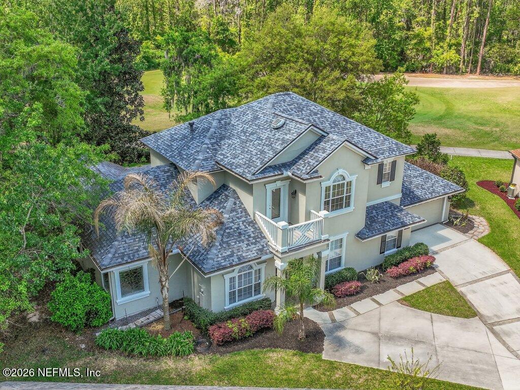 1664 Fairway Ridge Drive Fleming Island, FL 32003 - Photo 92 of 103 a aerial view of a house with a yard table and chairs