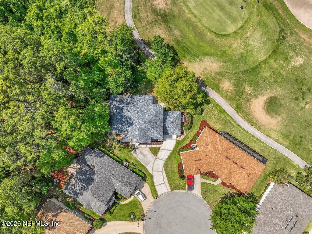 1664 Fairway Ridge Drive Fleming Island, FL 32003 - Photo 97 of 103 an aerial view of a house with a yard and trees