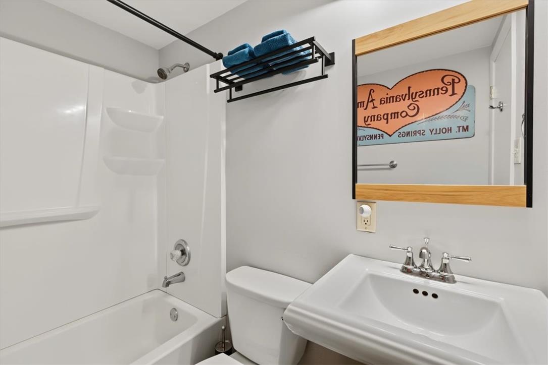 303 Cedar Road Hellertown, PA 18055 - Photo 10 of 27 Functional full bathroom with a bright white tub and sleek vanity.