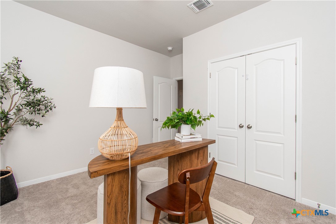 736 Jersey Court Troy, TX 76579 - Photo 14 of 32 a view of a workspace room with furniture and wooden floor