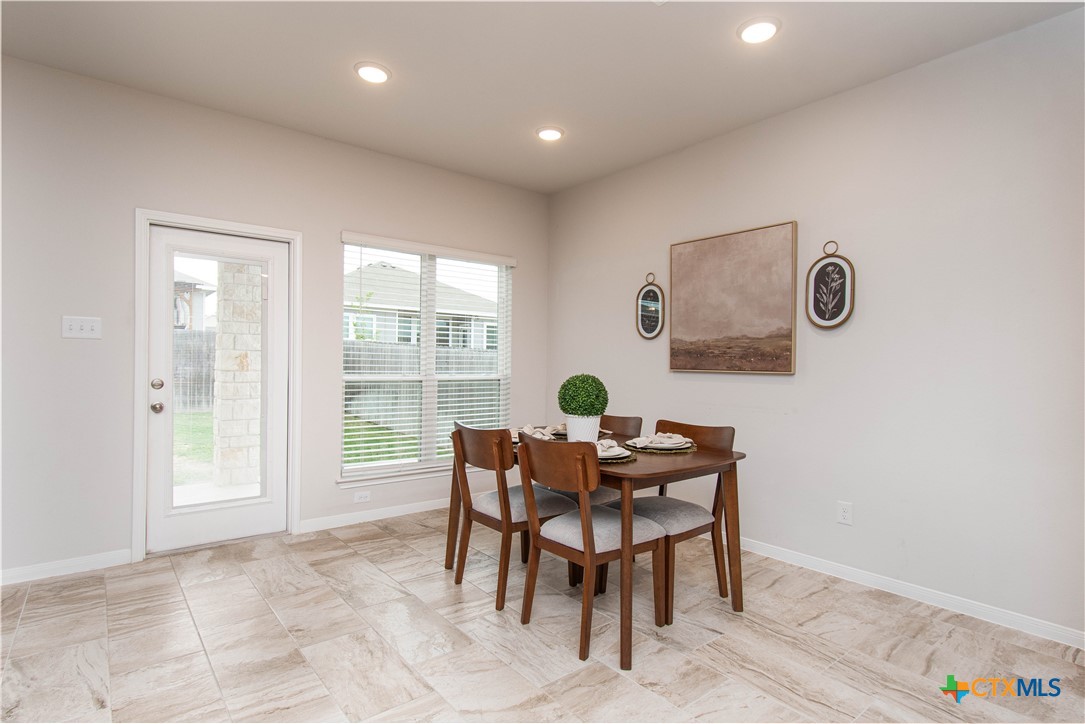 736 Jersey Court Troy, TX 76579 - Photo 7 of 32 a view of a dining room with furniture and a window