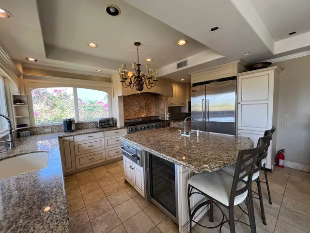a kitchen with stainless steel appliances granite countertop counter space a sink cabinets and appliances