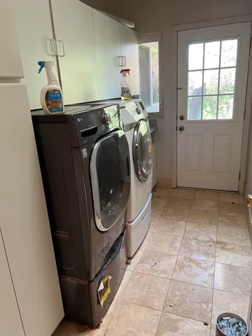 a utility room with dryer and washer