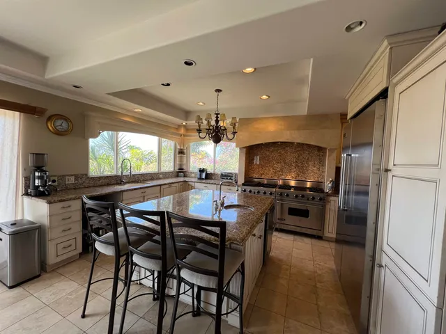a kitchen with a table and chairs in it