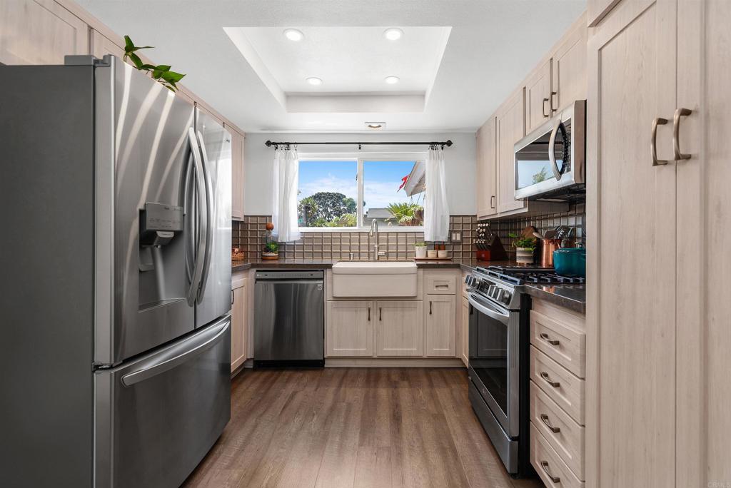 2046 Ups Circle Oceanside, CA 92054 - Photo 12 of 35 a kitchen with a refrigerator stove and sink