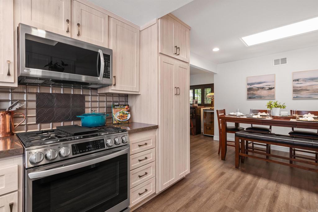 2046 Ups Circle Oceanside, CA 92054 - Photo 14 of 35 a kitchen with stainless steel appliances a stove a microwave a sink and cabinets