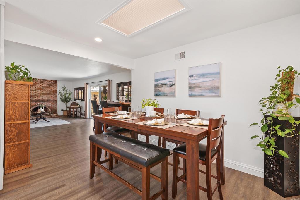 2046 Ups Circle Oceanside, CA 92054 - Photo 16 of 35 a view of a dining room with furniture and wooden floor