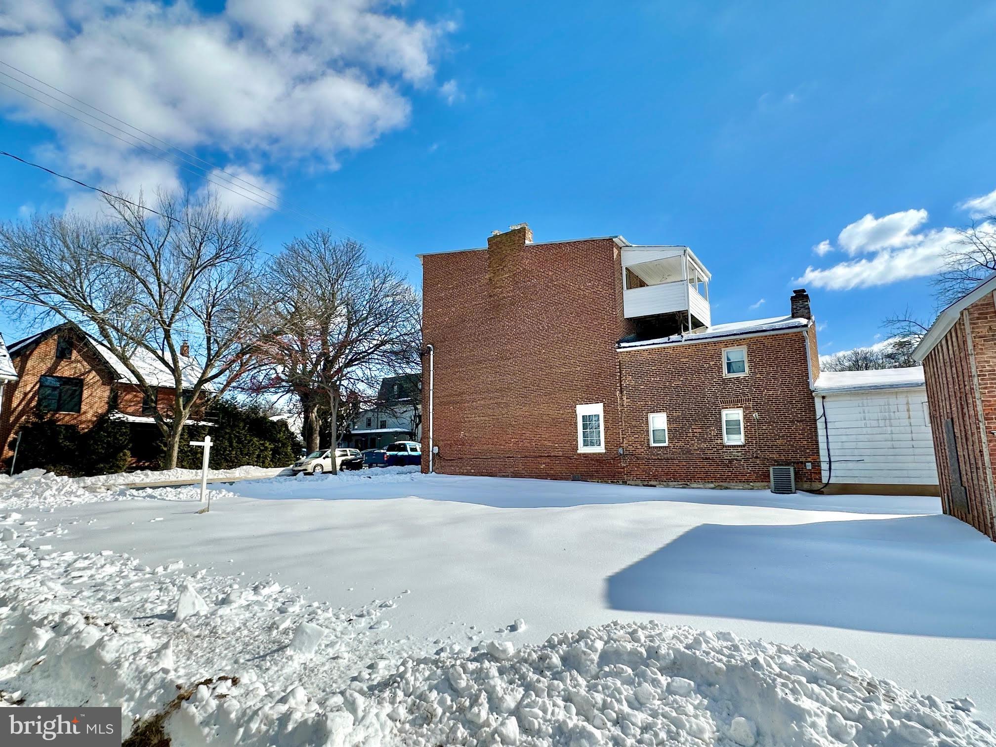 288 East Main Street Westminster, MD 21157 - Photo 5 of 8 a view of a building with snow on the road