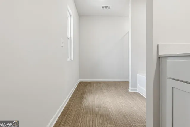 a view of small space with wooden floor