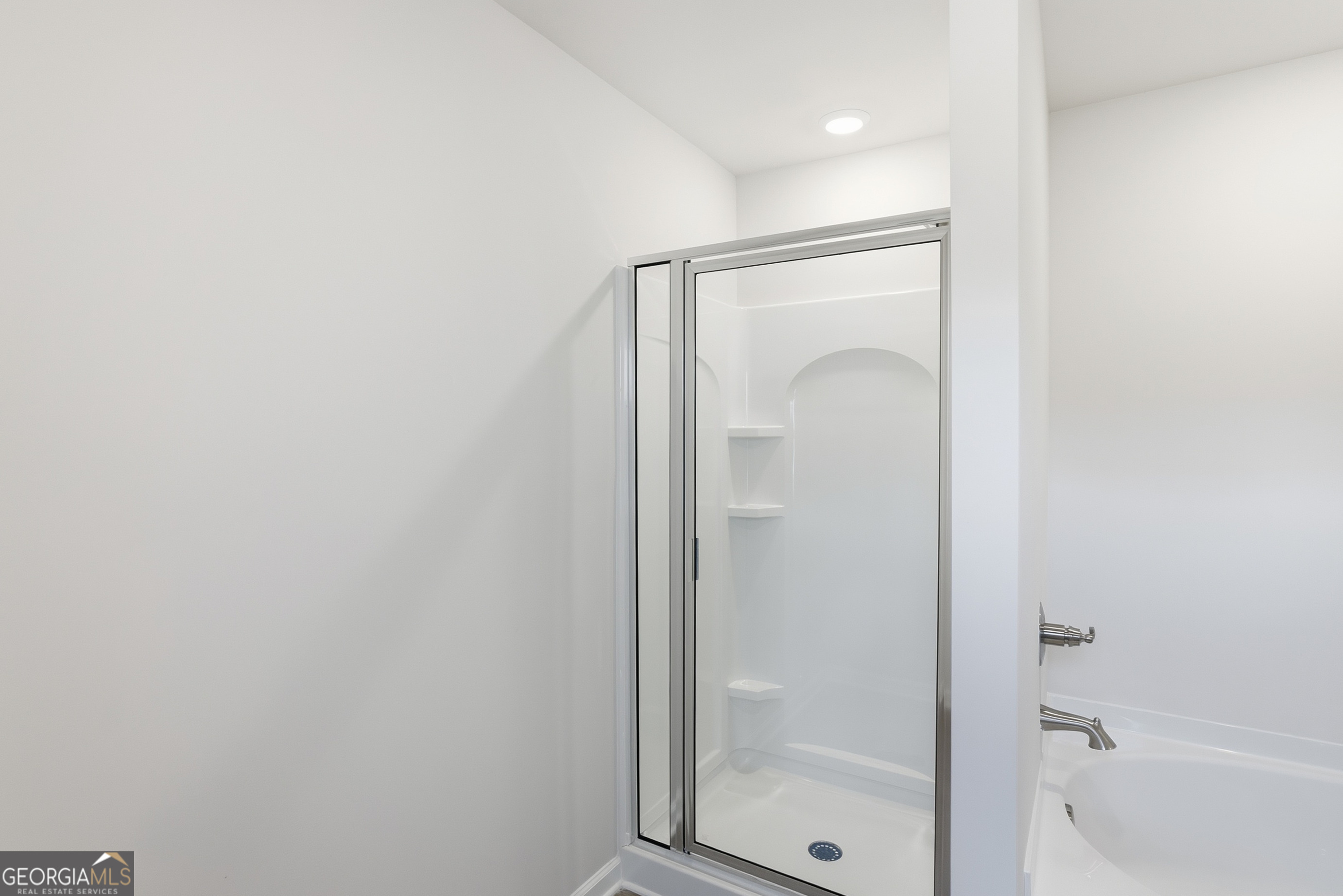 30 Umber Lane Newnan, GA 30263 - Photo 23 of 33 a bathroom with a glass shower door