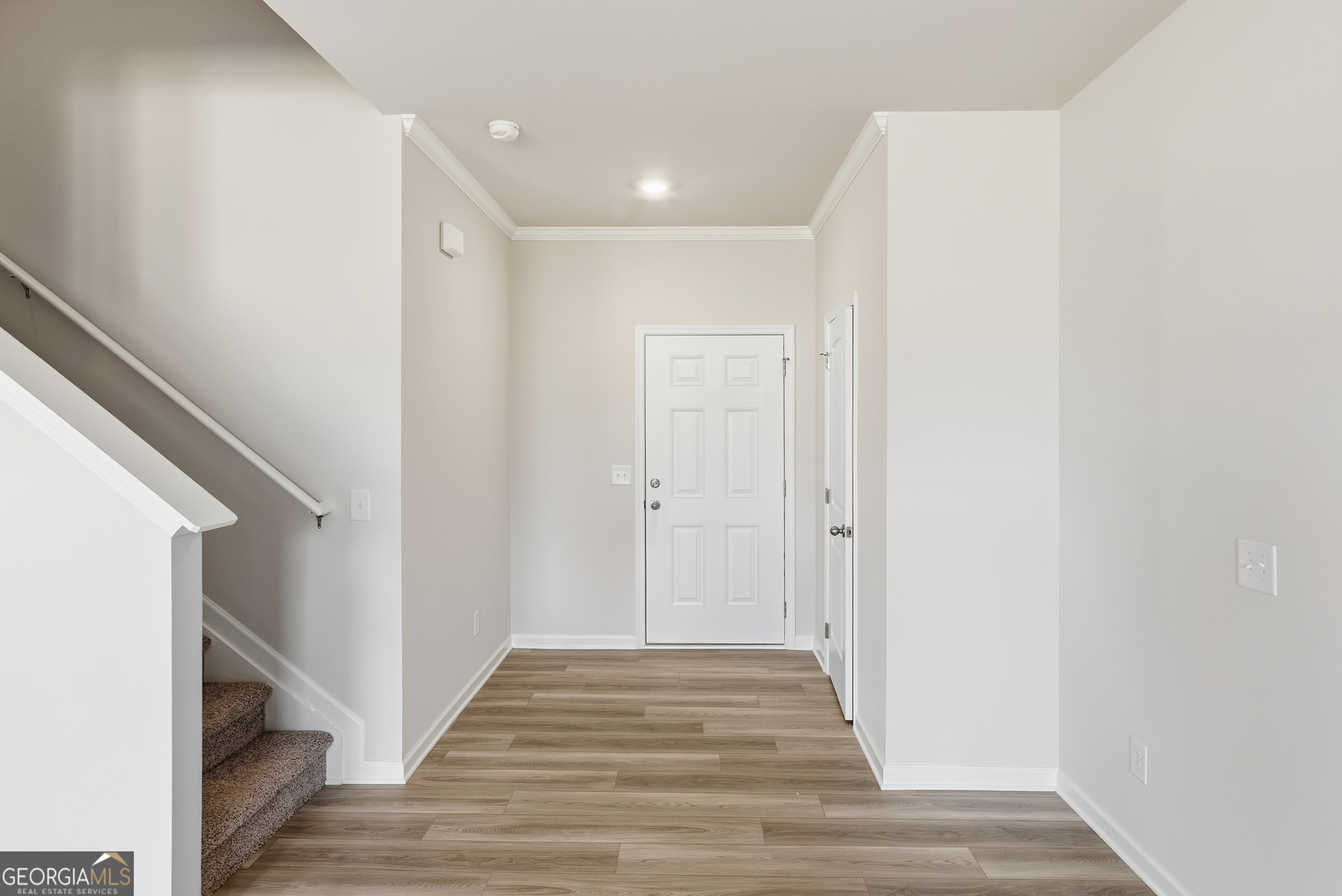 30 Umber Lane Newnan, GA 30263 - Photo 4 of 33 a view of a hallway with wooden floor and entryway