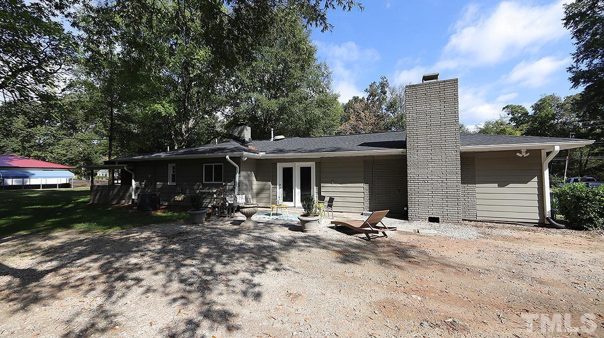 3811 Pickett Road Durham, NC 27705 - Photo 19 of 22 a view of a house with backyard and sitting area