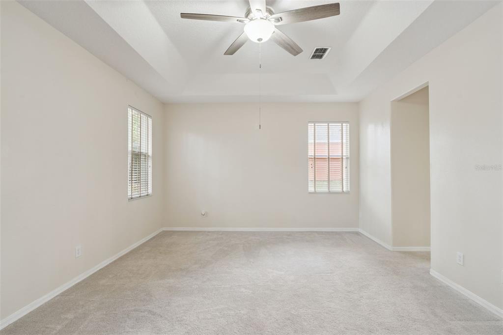 597 Sand Wedge Loop Apopka, FL 32712 - Photo 22 of 40 wooden floor in an empty room with a window