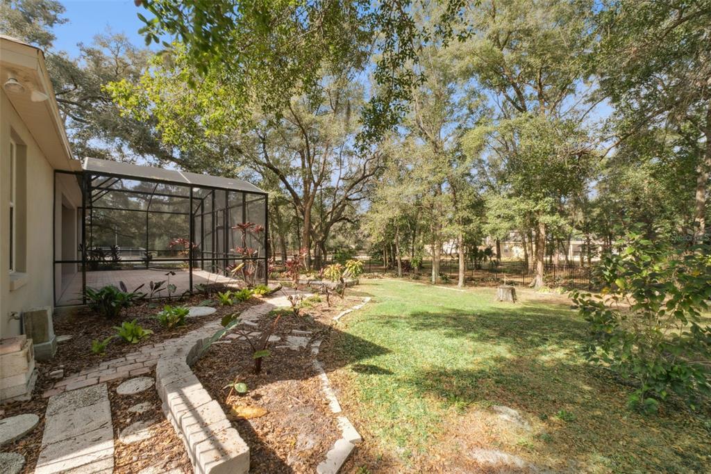 597 Sand Wedge Loop Apopka, FL 32712 - Photo 37 of 40 a backyard of a house with yard and outdoor seating