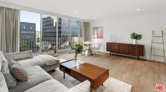 a living room with furniture a lamp and a large window