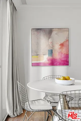 a room with a table and chairs