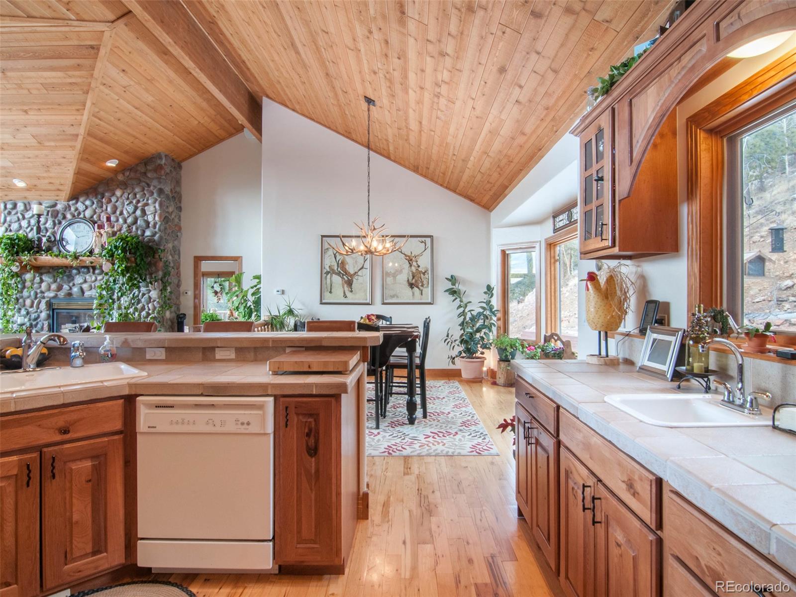 850 Royal Ridge Drive Bailey, CO 80421 - Photo 13 of 35 a kitchen with lots of counter top space and wooden floor